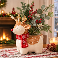 LUMIDED® baby reindeer Christmas ceramic vase full product view on festive table runner with fireplace and candles, filled with red berries, cedar and eucalyptus in full woodland Christmas arrangement